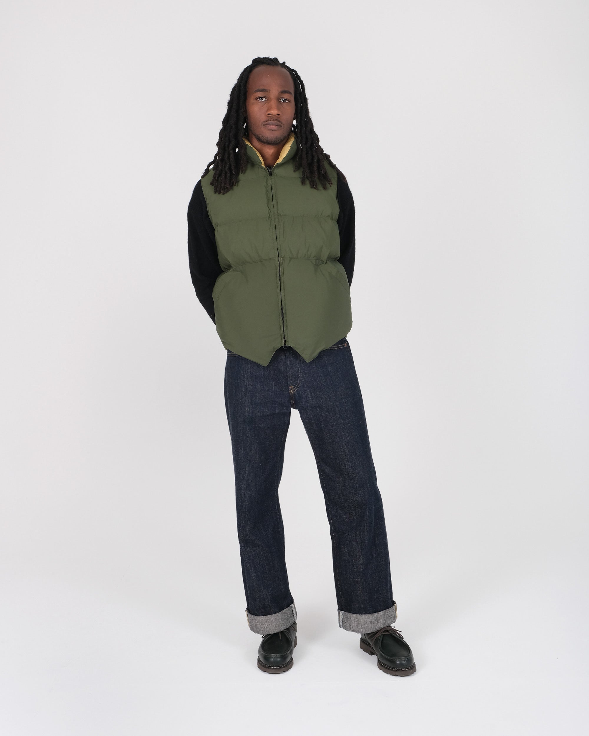 Model wearing the Crescent Down Works "Green" colorway of the North by Northwest vest. 