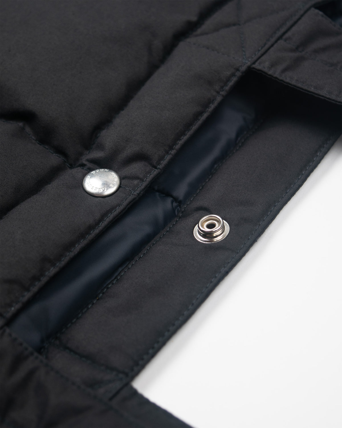 Black quilted tote with silver snap buttons and black lining in down tote dry wax cotton black
