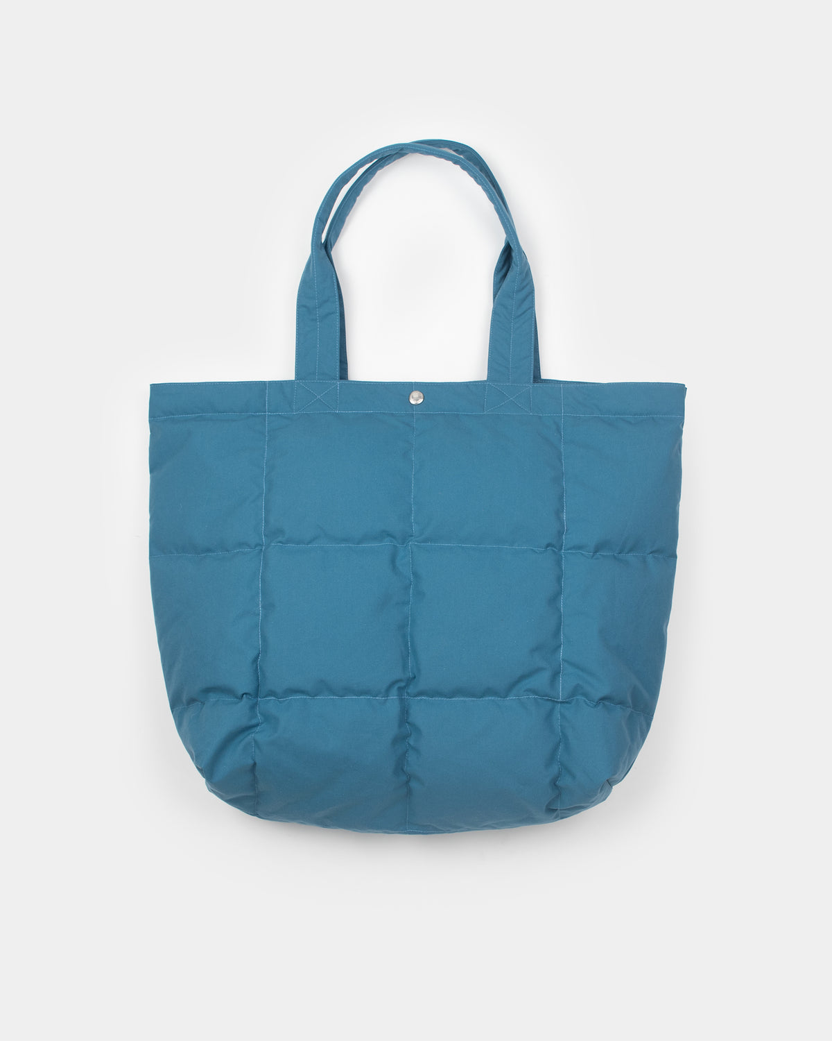 A Robin blue quilted puffer tote bag with matching fabric handles, shown against a plain light gray background.